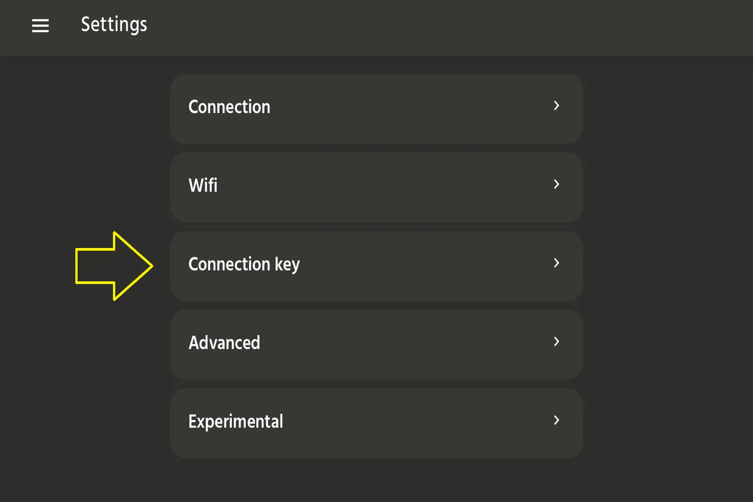 Écran des paramètres de l’application The Handy avec une flèche pointant vers l’option Connection key.